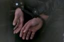 Stock image of man in handcuffs