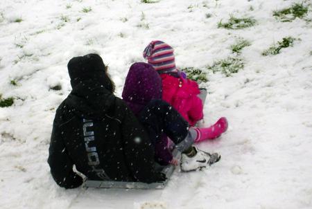 Jamie, Phoeba and Amelia on a homemade sleigh on Sholing Green
