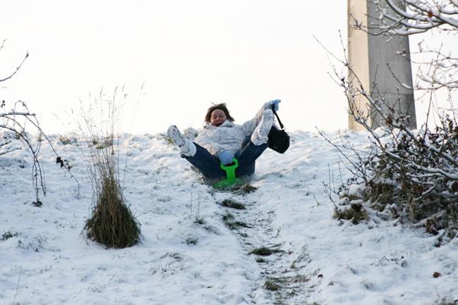 My sister sledging in Mayfield Park. She just wouldn't put her handbag down!