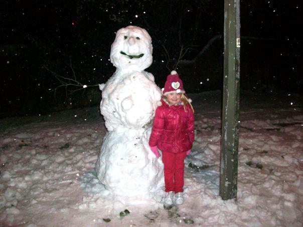 My granddaughter Paige with her snowman by Anne Sargent.