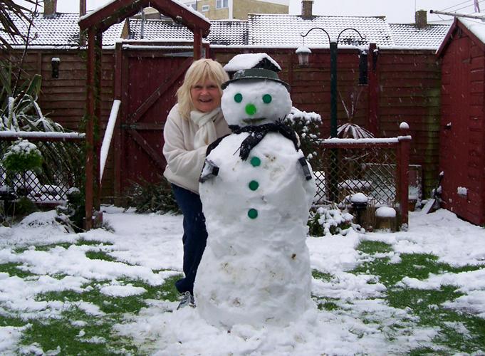 Nanny Robinson of Southampton with her snowman.