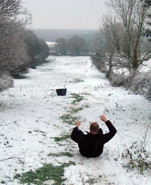 My fiance Leigh sledging on a metal tray in Rownhams on his 32nd birthday! by Sarah Kosten.
