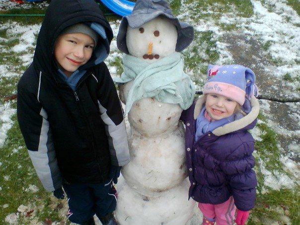 Brandon and Jasmine had fun building a snowman in the back garden.
