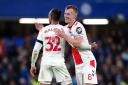 Jan Bednarek (right) and James Ward-Prowse celebrate after the Premier League match at Stamford Bridge, London. Photo: PA