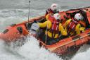 Members of Calshot RNLI showcase their new lifeboat, David Radcliffe, after its official naming ceremony