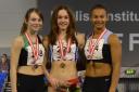 On the podium: holly Mills (centre) is crowned U17 long jump champion