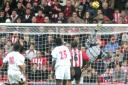 AT FULL STRETCH: Third-choice Saints keeper Alan Blayney tips an effort over the bar to atone for his error that enabled West Brom to make an immediate reply to Anders Svensson's opener.