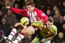 COMING THROUGH! Graeme Le Saux shows his battling qualities as he is sent flying by the challenge of Norwich City's on-loan midfielder David Bentley - while still managing to hold on to the ball. Daily Echo picture by: Chris Moorhouse. 