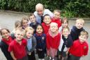 TOP MARKS: Freemantle Church of England Infant School pupils with head teacher Kevin Barnett. 	Echo picture by Joanna Mann.
