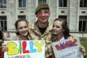 WELCOME HOME: Becky and Jess Skelton greet Billy Macguire.                Echo picture by Paul Collins. Order no: 8885776