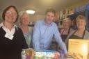 Winchester MP Steve Brine with volunteers at Winchester Basics Bank during his visit to the charity