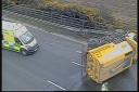 The overturned road sweeper on the M3