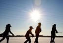 Children skating on a frozen lake