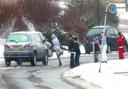 CLOSE RANGE: A gang of youths run into the road throwing snowballs at passing cars in Meggeson Avenue in Townhill Park.