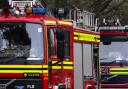 Fire destroys stables as horses are led to safety