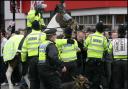 Police hold back Pompey fans following the FA Cup match