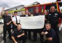 PC Gary Morgan (right) and colleagues hand over the big cheque for the James Shears and Alan Bannon Memorial Fund to firemen at St Mary’s Station. The money was raised at an event for members of the emergency services at the Oceana night club.