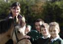Fiona King introduces New Forest pony Knightwood Minx to children from Bassett Green Primary School, Southampton, l to r, Kacper Lewandowski, David McKenzie and Gosia Marczak, all 8