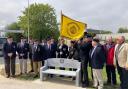 Members of the Royal Hampshire Regiment Comrades' Association unveil the memorial bench