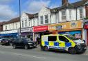 Police officers swarm shop on Shirley Road
