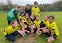 Marcus Kennedy with the under nine girls' football team