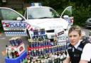 BOOZE HAUL: Acting Sgt Elizabeth Harfield with alcohol confiscated from under-age drinkers during a month-long crackdown.