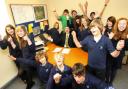CELEBRATING: Head teacher Chris Willsher and pupils of Priestlands School after the school’s ‘outstanding’ Ofsted report.