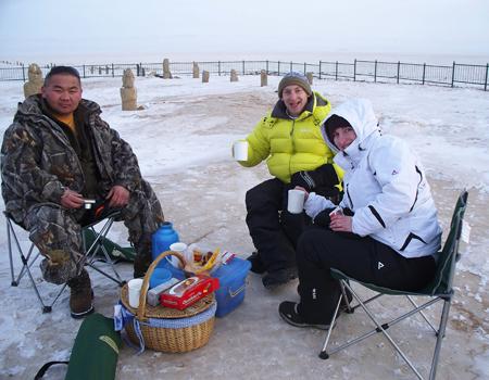 CHEERS: Andy Ife and wife Jill enjoy a picnice in Mongolia. He says the temperature was about -40C but they had a wonderful time with very friendly locals.