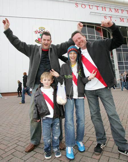Come on you Reds! Saint's fans cheer on the team before the game at St Mary's against Oldham.