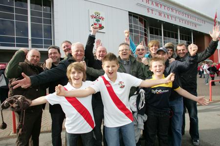 Come on you Reds! Saint's fans cheer on the team before the game at St Mary's against Oldham.