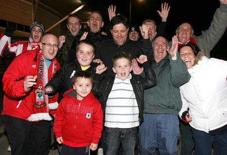 Jubilant Saints fans celebrate the 4-0 win over Dagenham & Redbridge
