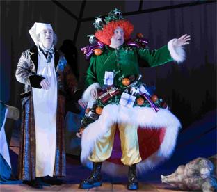 n YOU HAVEN’T A GHOST OF A CHANCE: Scrooge gets directions from the Spirit of Christmas Present.