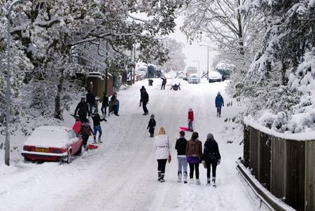 Today in south east road in sholing was a no go area for vehicles and childran and adults took full advantage and enjoyed the snow. photo by Andrew paine daily echo reader .