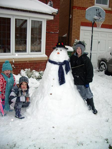 Arthur the snowman with Josh, Harrison and Evie.