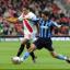 Alex Chamberlain battles for the ball with Brentford’s Craig Woodman.