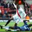 Osbourne tackles Do Prado.     It is forbidden to download or copy the images in this gallery.