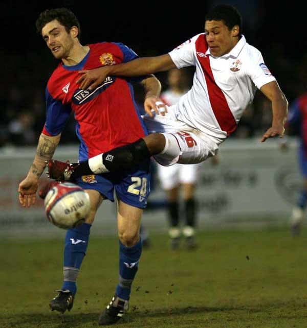 Alex Oxlade-Chamberlain is tackled by Billy Bingham. A selection of images from the Dagenham & Redbridge v Southampton League One match on January 3 2011