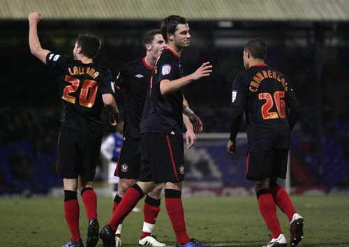 Team mates celebrate with Adam Lallana after his goal. A selection of images from Saints' 6-0 romp against Oldham at Boundary Park.
