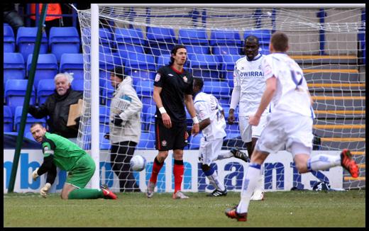 A mix up between Kelvin Davis and Jose Fonte lets Tranmere in for their first goal.
