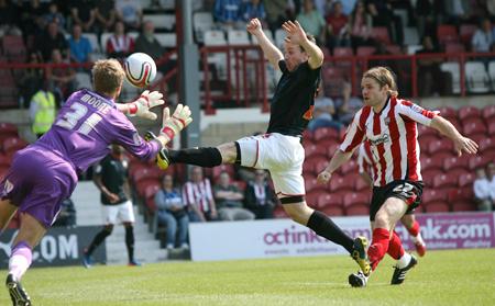 Pictures from the League One clash between Brentford and Saints.

It is strictly prohibited to copy, download, reproduce or distribute this image.