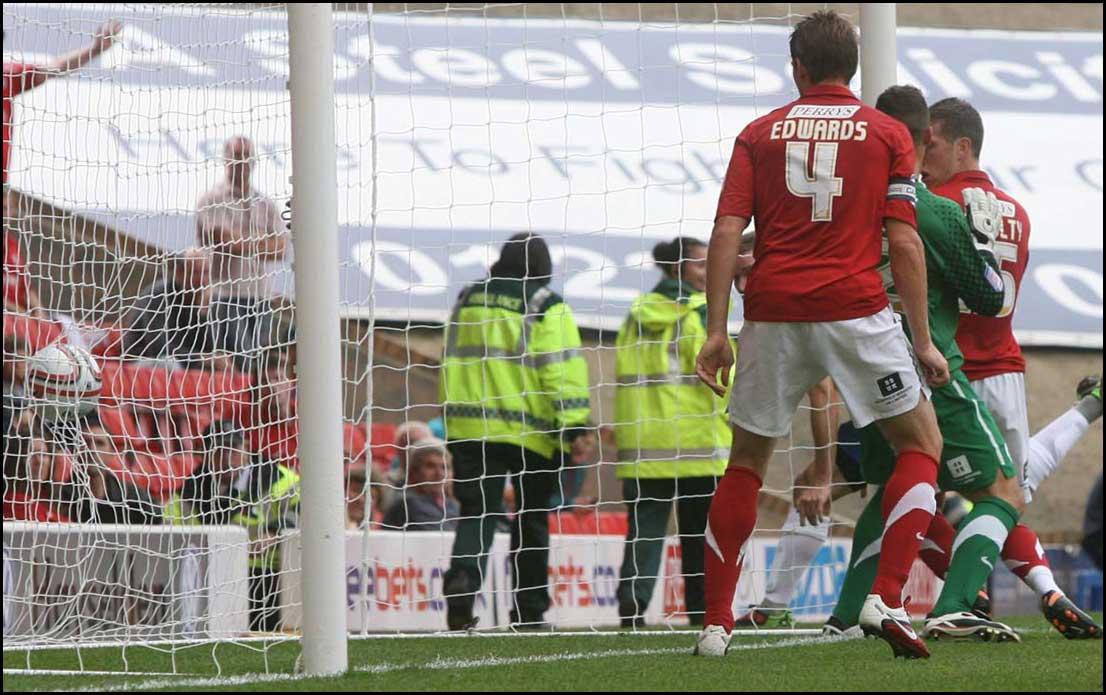 Photographs from Oakwell as Saints take on Barnsley in the Championship on August 13, 2011.
Connolly's goal hits the back of the net.