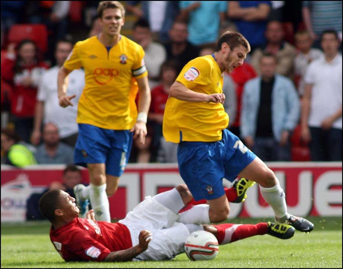 Photographs from Oakwell as Saints take on Barnsley in the Championship on August 13, 2011. Adam Lallana is brought down.