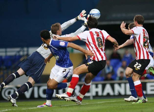 Jack Cork and David Connolly challenge the Ipswich keeper
