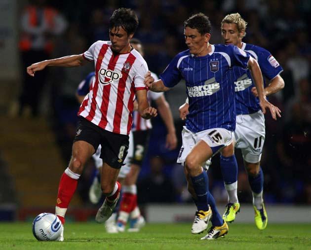 Jack Cork takes the ball away from Keith Andrews