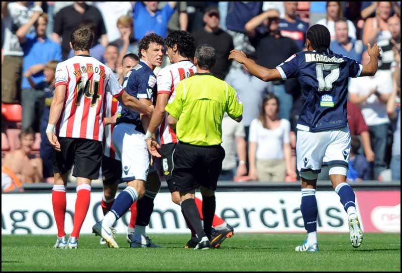 Jose Fonte clashes with Darius Henderson. Photos from Saints Championship match against Millwall on Saturday, August 20, 2011