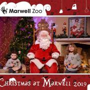 Poppy (right) and Alice Menzies meet Father Christmas at Marwell Hall