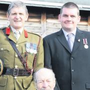 Colonel Terry Scriven, left, presented the HM Armed Forces Veterans Badge to the oldest veteran, 92- year-old Bert Thomas, and the youngest, 33- year-old David Miller.