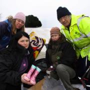 WHAT A MESS! From left – Suzi Woodgate, Jane Buckmaster, Brian Deacon and Linda Laker help gather the rubbish left over by the sledgers at Bolton’s Bench. 	Echo picture by Joanna Mann. Order no: 9749576