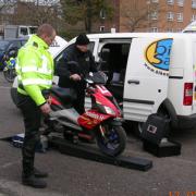 SAFETY DRIVE: A dynamometer proves the moped is derestricted by the speed reading, inset.