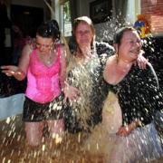 GUNGED: Nikki Henderson Corrine Walsh and Jan Henderson in a bath of beans and cornflakes at The Griffin pub fundraising event. Right, James Shears and Alan Bannon who died in a tower block fire. Order no. 10269402